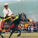 Litang Festival A Khampa is riding a horse for a contest