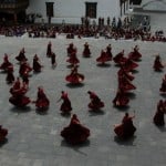Monks are at a rehearsal masked dance. Just before the commencement of the masked dance festivals, monks practised to perfect the steps involved with the various masked dances.