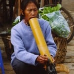 A man (miao minority) is smoking with Hookah