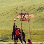 a group of Khampas are playing basketball at a spot with elevation of 4300m